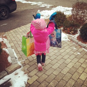 The bag of snowpants and boots were almost as big as her -- no problem.