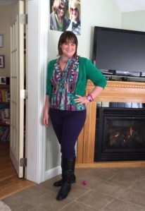 Purple jeans, colorful top, green cardigan, black boots, vintage crystal necklace.